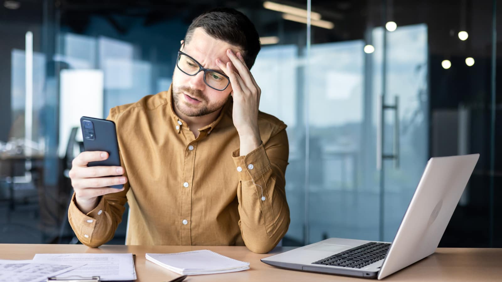 Business owner checking a missed enquiry on his phone